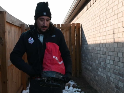 pest control technician spreading granule product